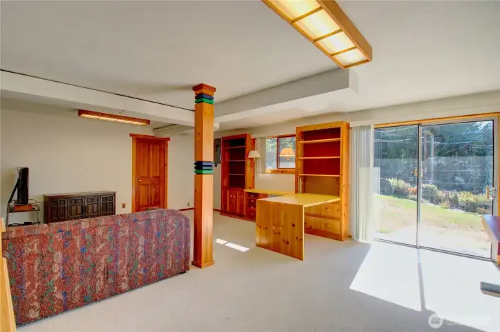 Basement looking toward sliding door to patio.