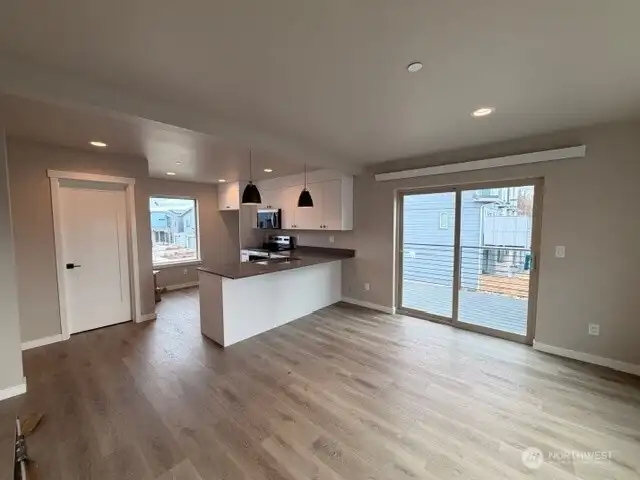 Living & kitchen with view of spacious deck