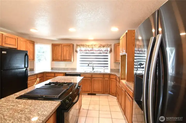 kitchen area with two refrigerators