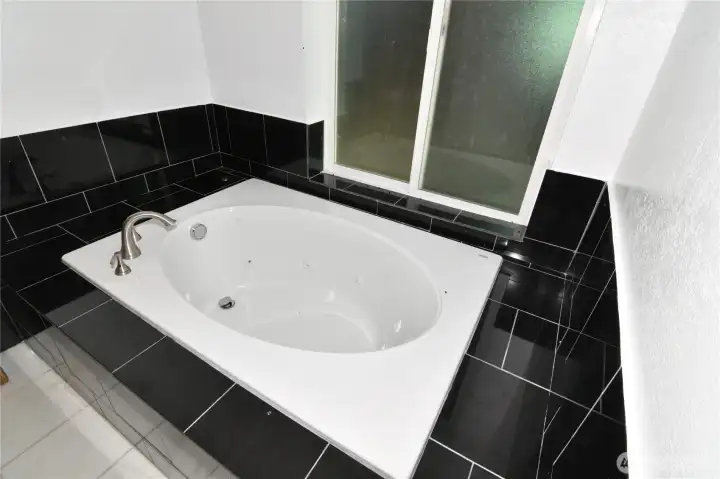 bathtub in primary bathroom