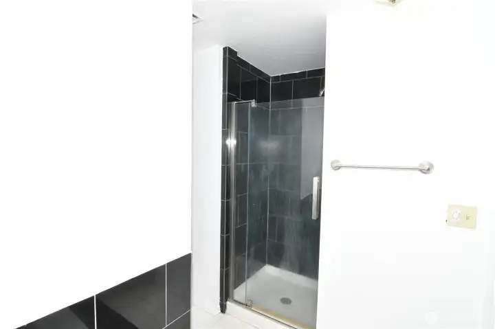 walk-in shower with tile surround