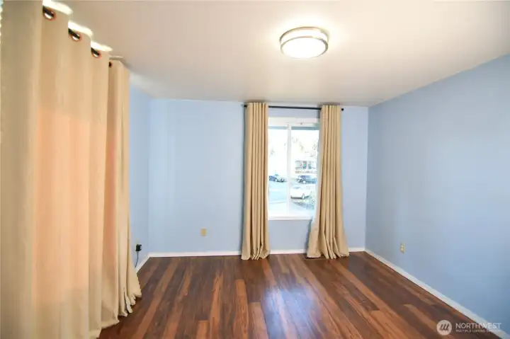 bright third bedroom with window overlooking the front yard and side yard