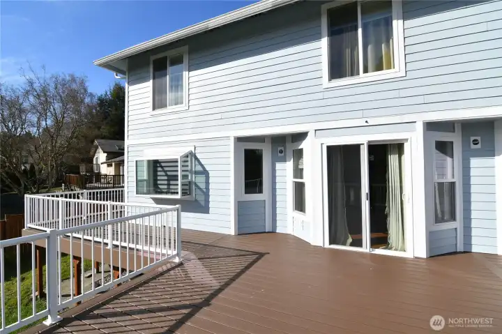 deck with sliding glass door to dining room and kitchen garden window