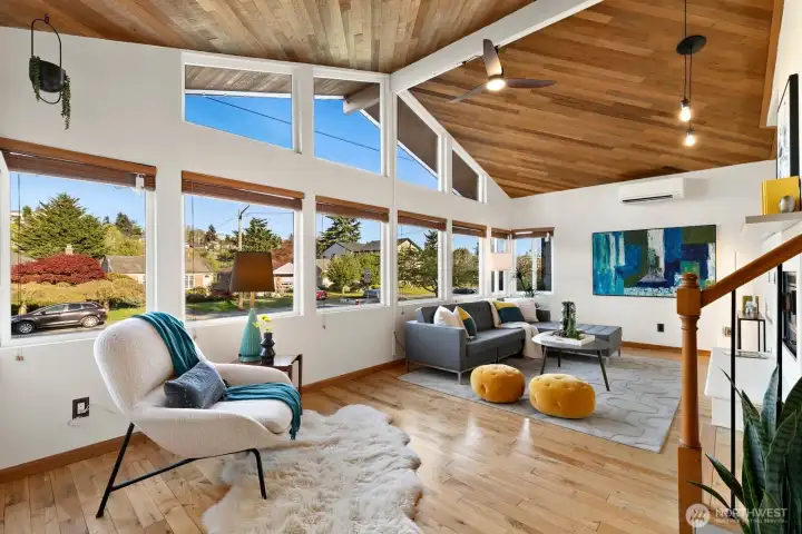 Living room with tons of natural light and vaulted ceilings