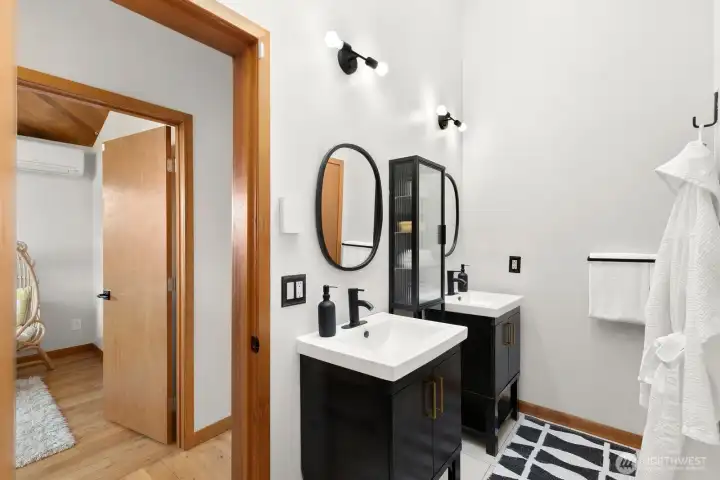 Full bathroom with separate bathtub and shower upstairs