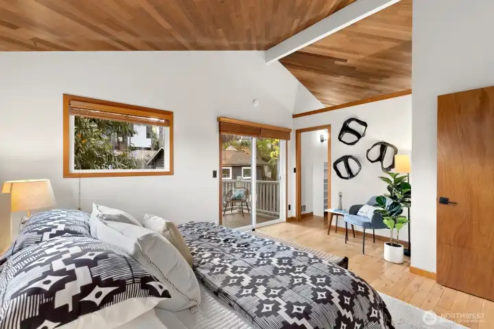 Primary bedroom has walk in closet and balcony