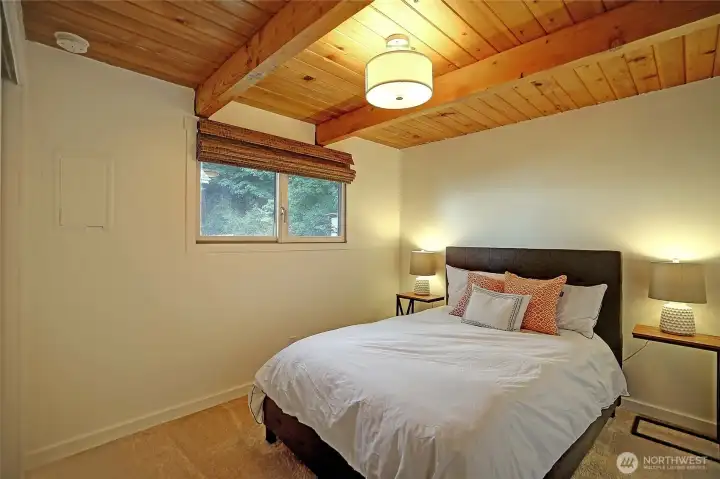 Bedrooms updated with new carpet, radiant wall heaters, modern light fixtures, and refreshed doors, trim, and closet hardware for a stylish and comfortable retreat.