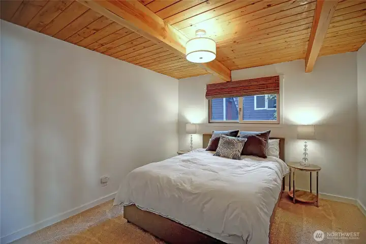 Stylish bedrooms with new flooring, efficient radiant wall heating, contemporary light fixtures, and refreshed doors and trim throughout.