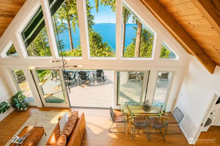 Stunning wall of windows fills the interior with natural light and breathtaking views of Puget Sound and Mt. Baker in this updated waterfront home.