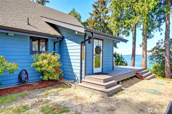 Welcoming front door opens to a bright entryway and mudroom.