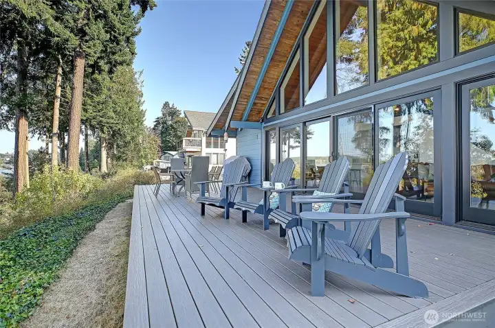 Enjoy seamless indoor and outdoor living on the spacious deck with new expansive windows and sliding doors.