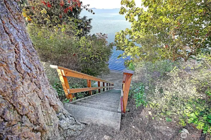 Just steps away from your porch are these rebuilt stairs with railings, providing easy access to your beach.
