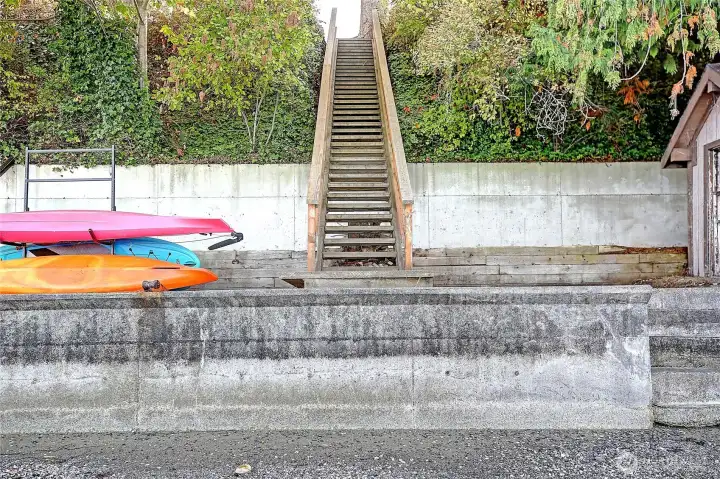 View the private stairs surrounded by lush greenery, leading up from your own private beach access.