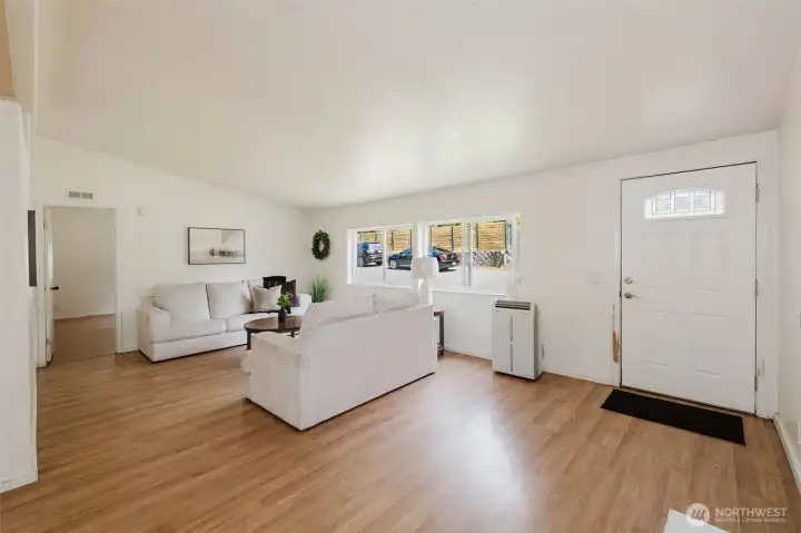 Living room, door to left of photo leads to primary bedroom.