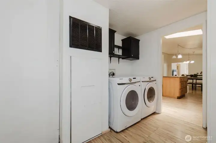 Washer and dryer stay. Door to backyard off utility room.