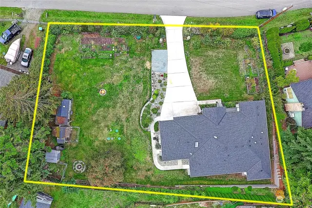 Overhead views with approximate boundary lines to the almost half acre property.