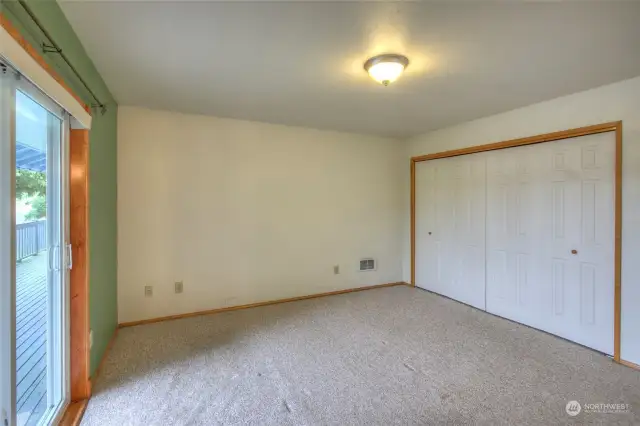 The primary features large closets and another slider out to the rear deck, with canal views.