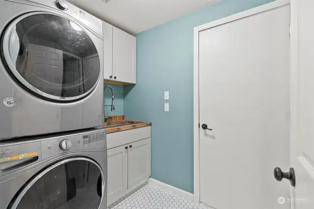 Utility room with laundry on main coming in from garage. W & D convey!