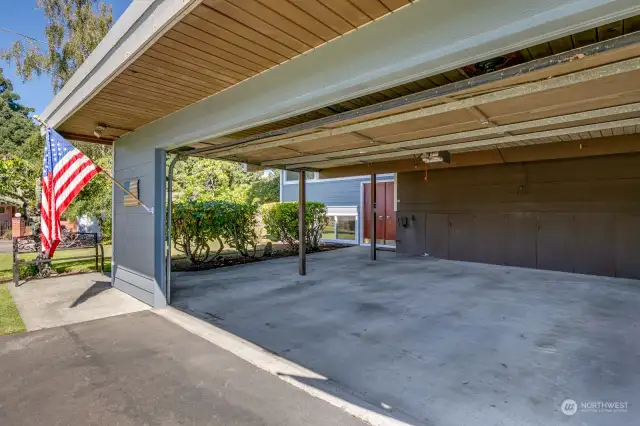 Two-car garage has one exposed wall.