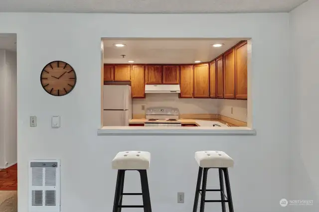 Eating bar open to kitchen.