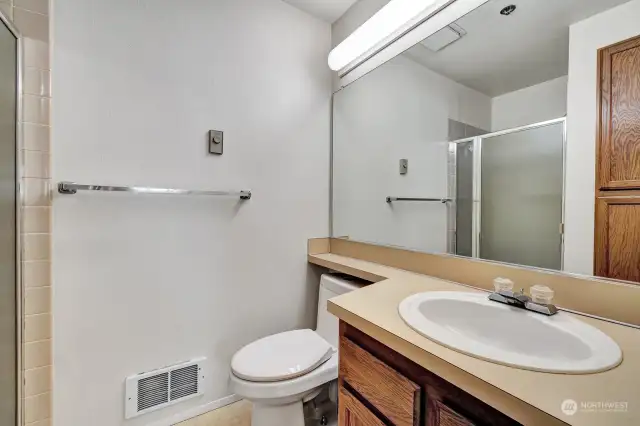 Primary full bathroom with linen closet.