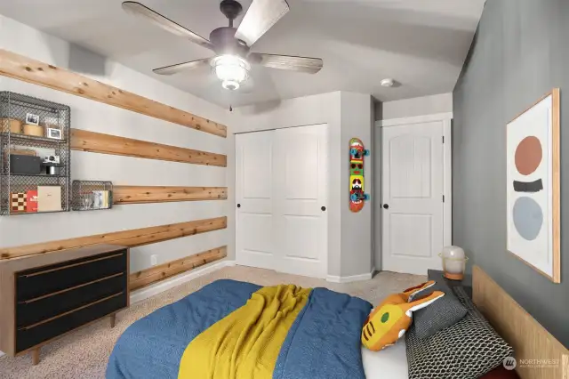 2nd bedroom upstairs with ceiling fan and stylish details. Virtually Staged