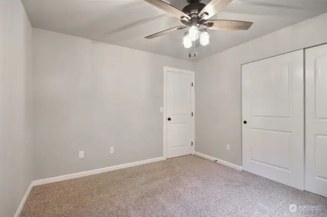 4th bedroom upstairs with ceiling fan.