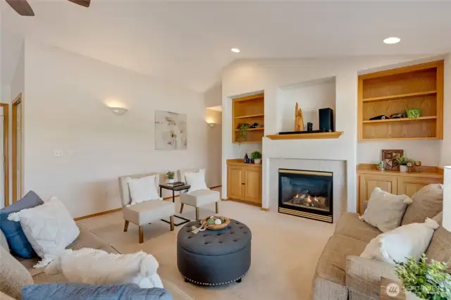 Whether you're curled up with a good book or hosting a lively gathering, this sunlit space effortlessly sets the tone.