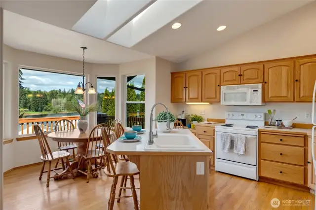 Skylights overhead fill the room with natural light, creating a bright and airy feel throughout the day.