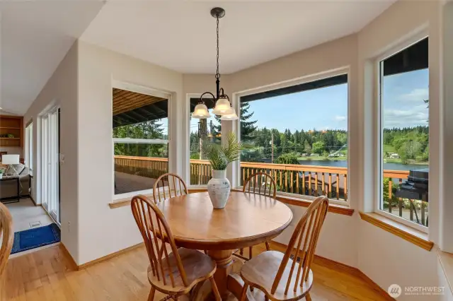 The adjacent dining area offers the perfect setting for family meals or holiday dinners, all while enjoying the scenic water view.