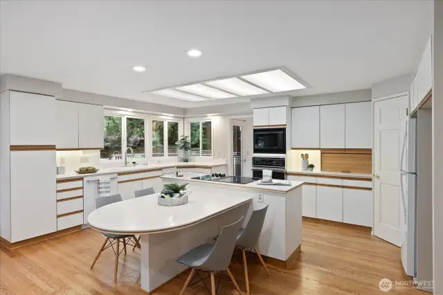 Kitchen with central island and eating space.