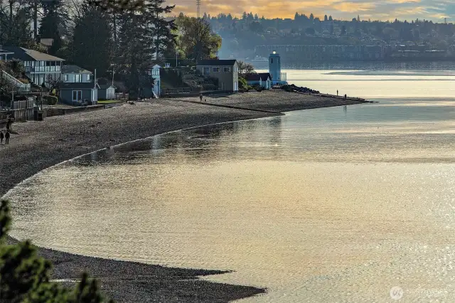 From the comfort of your own hillside perch, behold the tranquil sweep of Caledonia Cove—the curve of shoreline, the lighthouse sentinel, and the quiet shimmer of Puget Sound at rest. This ever-changing tableau, visible from within the home, anchors daily life in nature’s poetry and the deep rhythms of the Salish Sea.