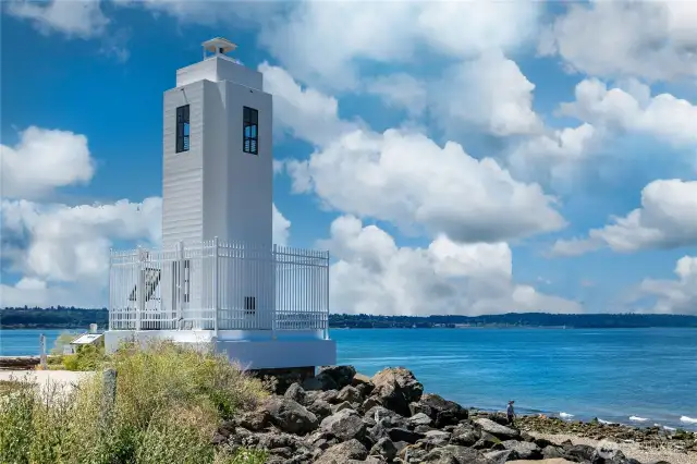 Just down the hill from 7314, the historic Browns Point Lighthouse stands sentinel where sky meets sea. Still active and lovingly preserved, it’s more than a navigational aid—it’s a neighborhood icon, a photographer’s dream, and the soul of Caledonia Cove. Its adjacent Keeper’s Cottage is available for overnight stays, offering romantic guest lodging just a short stroll from your front door.