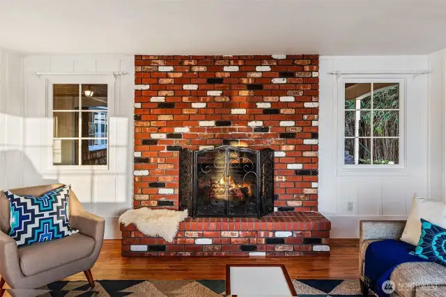 Anchoring the living room with nostalgic charm, this whimsical brick fireplace nods to the home’s mid-century roots. Whether it’s a stormy Northwest evening or a golden fall morning, the flicker of firelight brings warmth, comfort, and connection—an enduring centerpiece for life above Caledonia Cove.