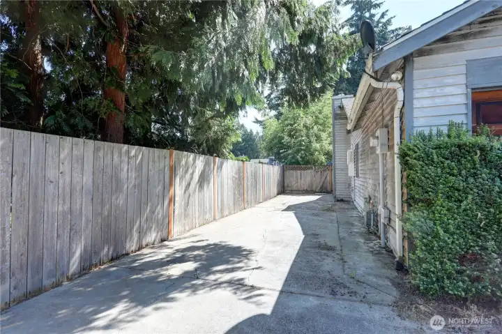 Expansive side driveway offers plenty of room for RV, boat, or extra vehicle storage.