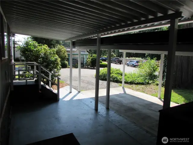 COVERED CEMENT FLOOR AREA OFF FRONT DOOR ENTRY.