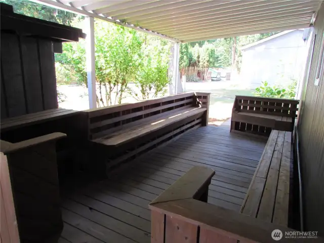 SEMI-PRIVATE DECK AREA, ACROSS STREET FROM WOODED AREA BEHIND FENCE, PARKS GARBAGE AND YARD WASTE DROP OFF IN BACK LEFT CORNER IN PHOTO