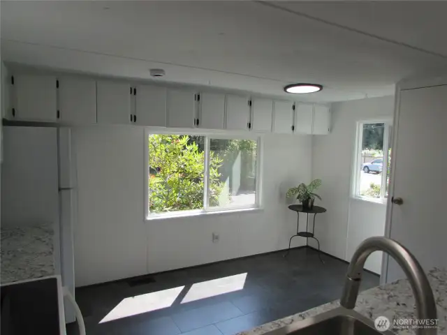 EXTRA OVERHEAD STORAGE IN KITCHEN, GOOD NATUAL LIGHTING IN DINING AREA.