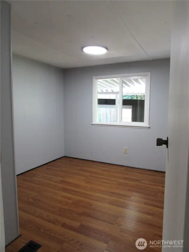 SPARE BEDROOM WINDOW OVERLOOKS COVED AREA IN FRONT OF HOME.