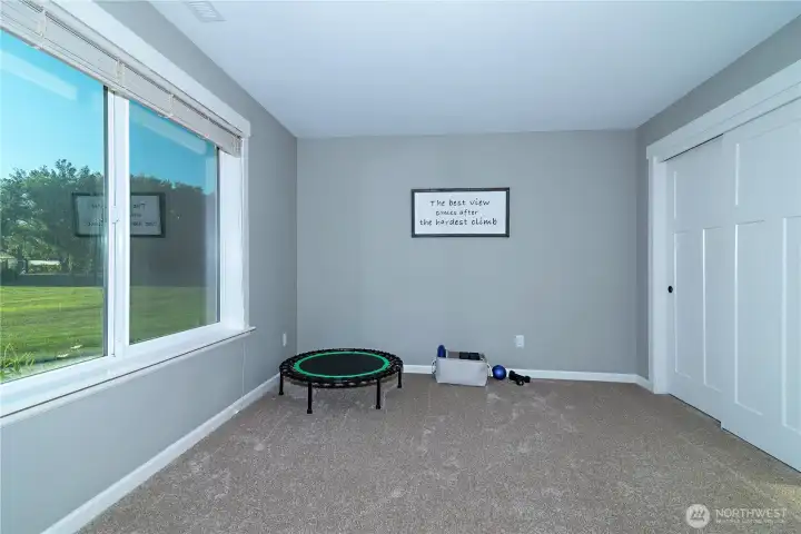 Spacious bedroom with views of front of property