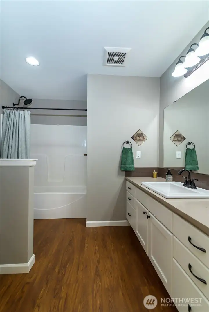 Hall bath has exceptional storage