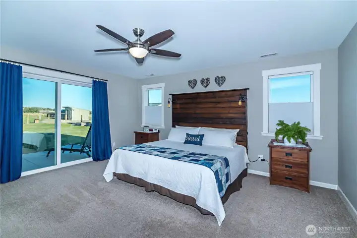 Wake to the morning sun from this primary suite