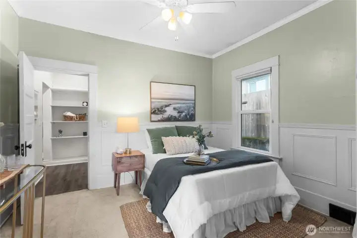 The back bedroom is the largest, with a walk-in closet