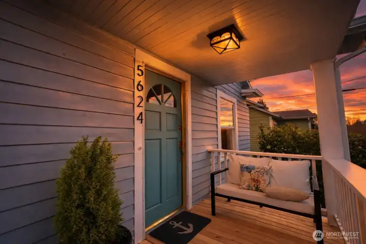 Welcoming front porch set high above the street. Perfect place to watch the neighborhood go by.