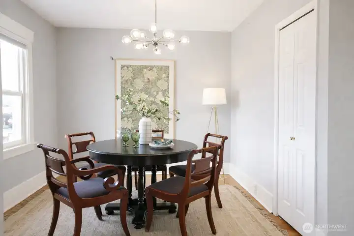 Gracious dining room  with hardwood floors and a large picture window. Prior owners had it closed off from living room and it was used as a bedroom. Enjoy the open, light filled space. With the eat-in kitchen you could use this room any way you'd like.