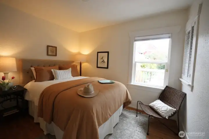 Main floor Primary bedroom with an updated full bathroom next door.