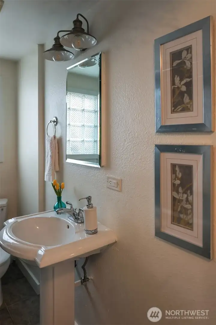 Main floor bath with tub and shower and built in storage.