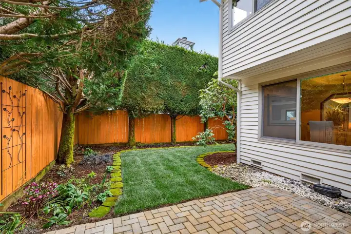 Easy outdoor living with a true extension of the main level, plus a paver walkway that leads through the landscaped side yard. The flow supports effortless movement between entertaining areas and outdoor spaces.