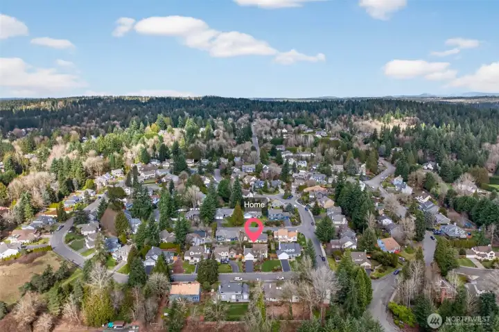 Neighborhood aerial view placing the home within the Olde Morrison Place area on English Hill, surrounded by established homes and greenery. A convenient Redmond location with quick access to everyday amenities and commuting routes.