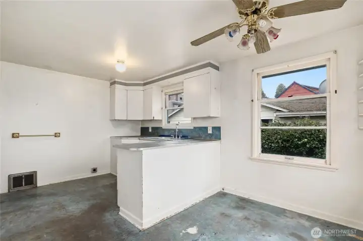 Kitchen with separate eating space. Oven has been installed since photos were taken.
